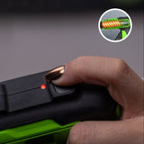 Close-up of a hand holding a green and black device with a small inset showing a close-up of the device's interior.